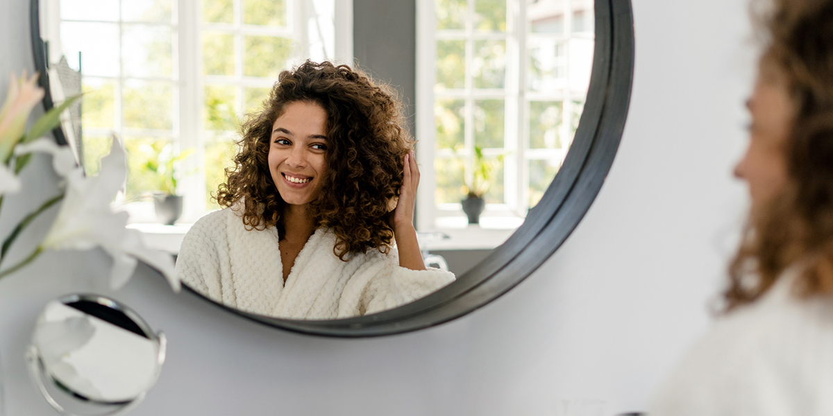 lady smiling in mirror