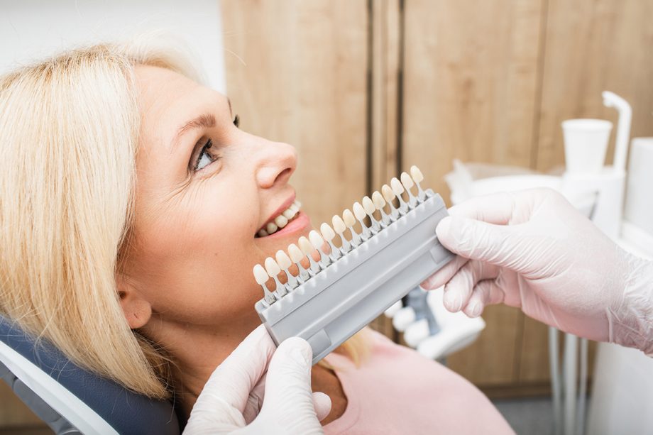 dentist compares whiteness scale to woman's teeth